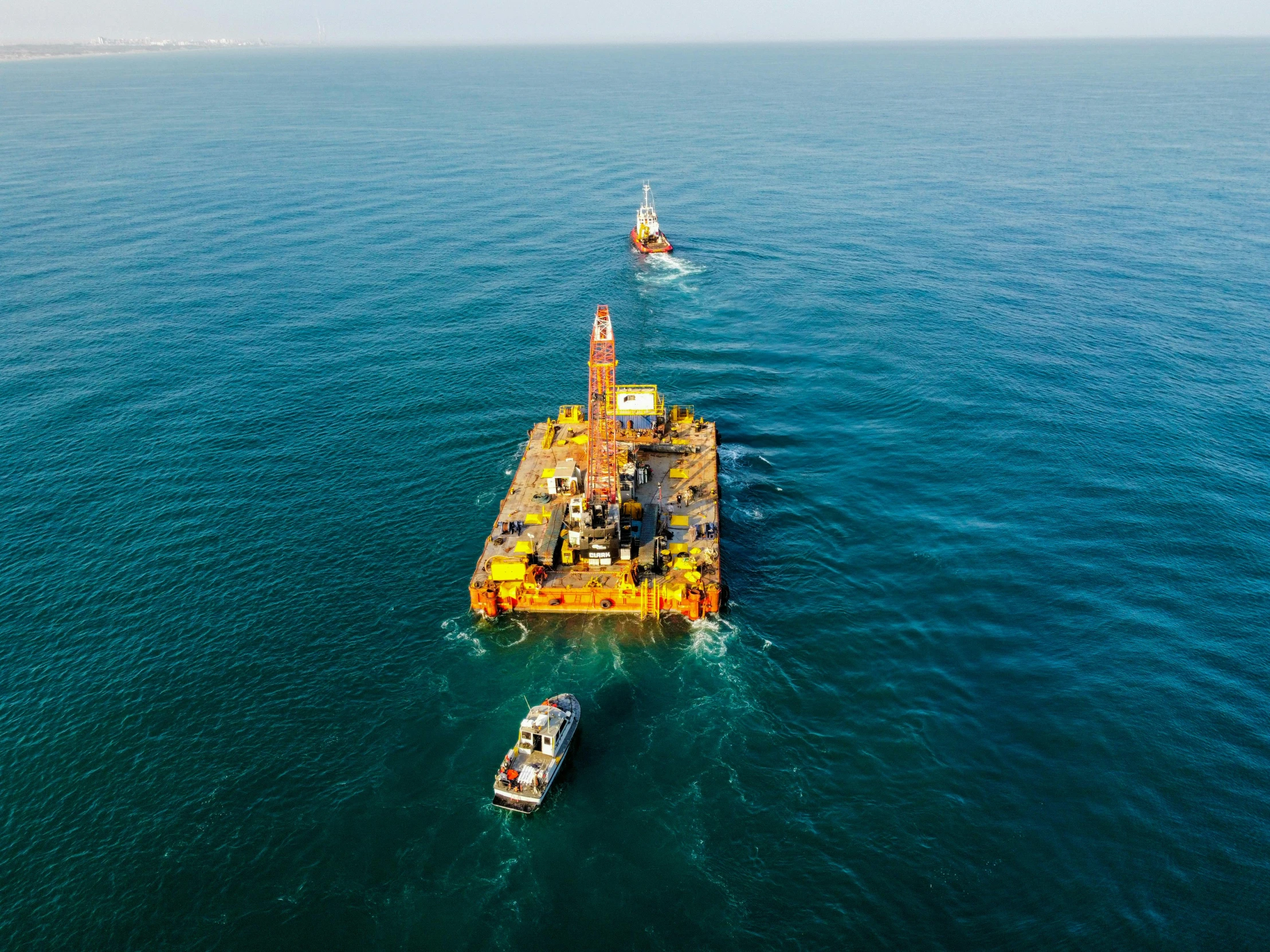 a large barge floating across a body of water