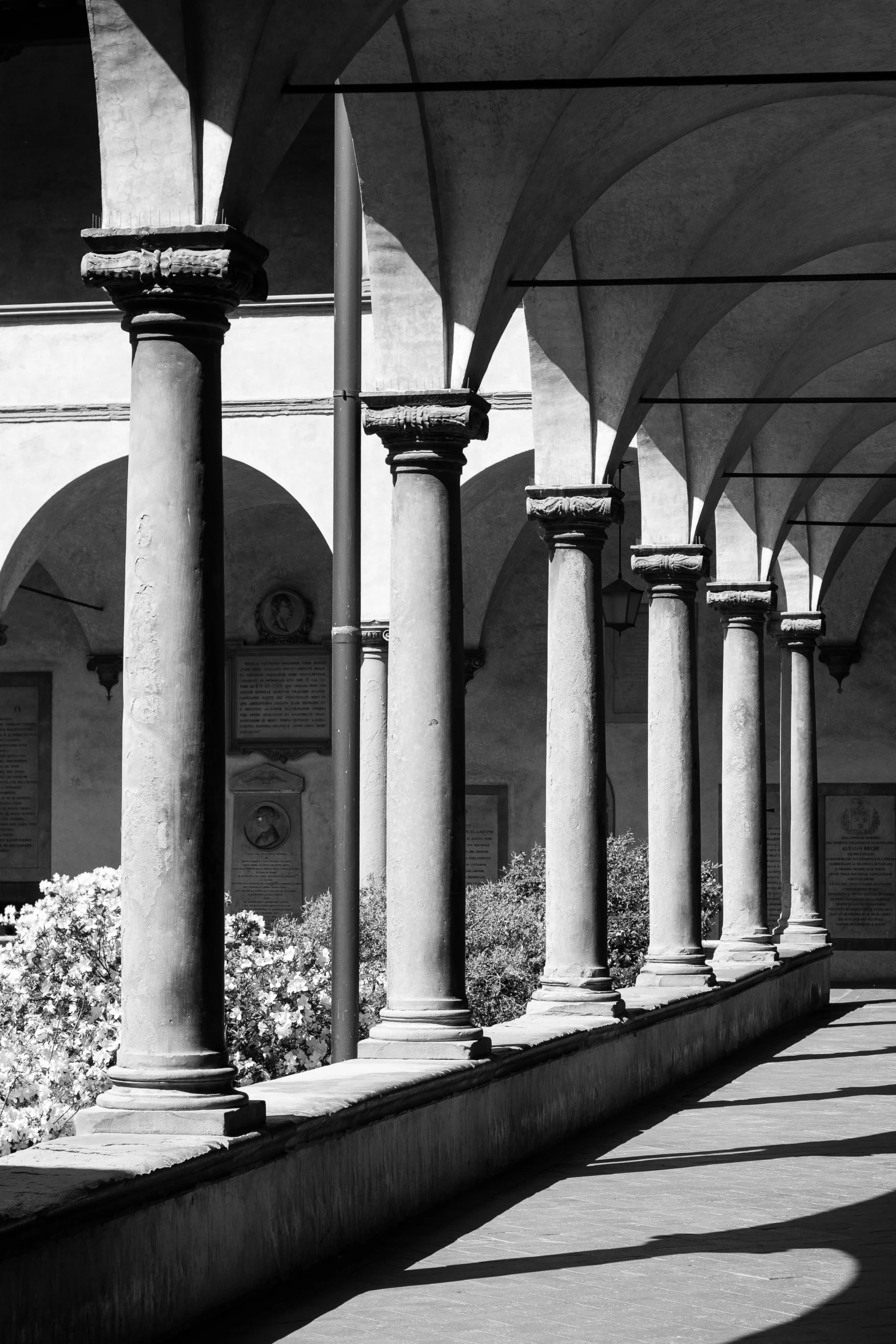 a large building with pillars and other arches