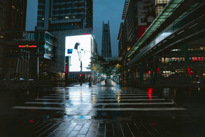 an image of a city at night on a rainy day