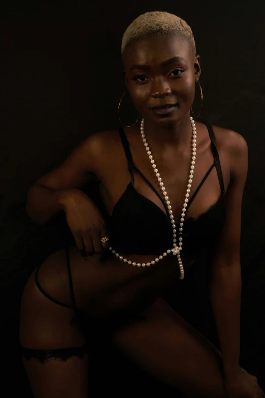 a beautiful woman wearing a lingerie in the dark