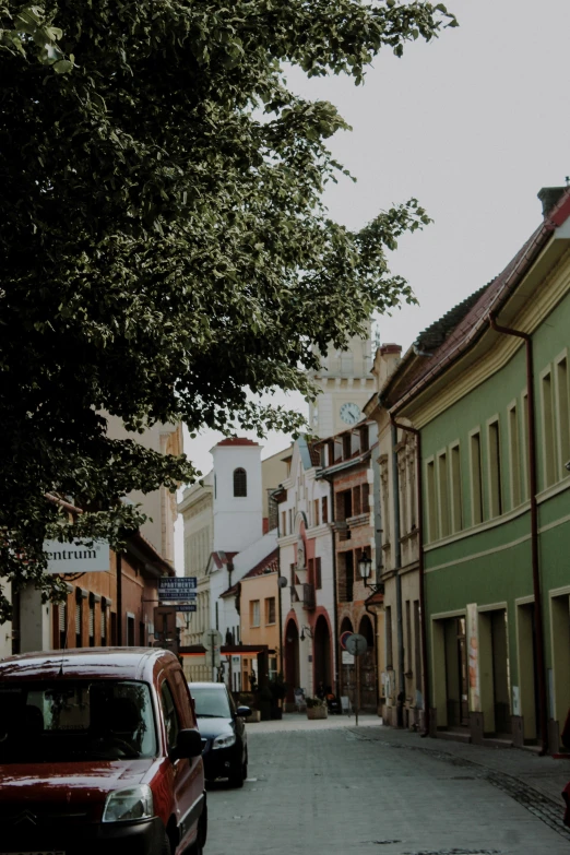 the cars are parked at the side of the street