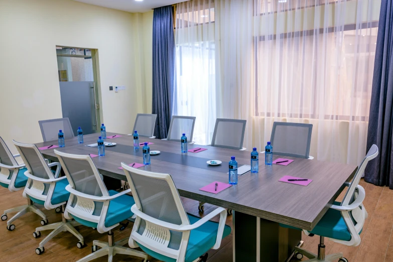 conference room set up with many chairs and tables