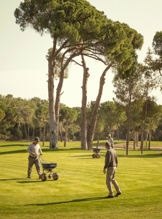 a man playing frisbee golf with a man hing a stroller