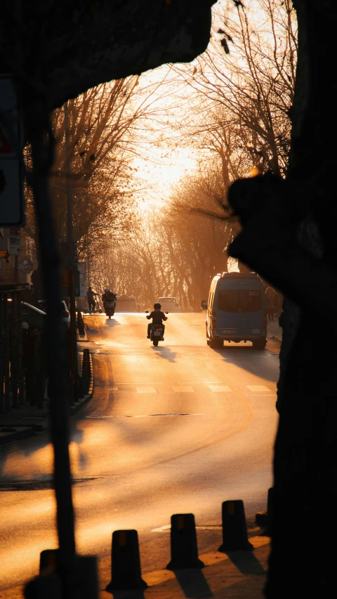 a motor bike traveling down a snow covered street