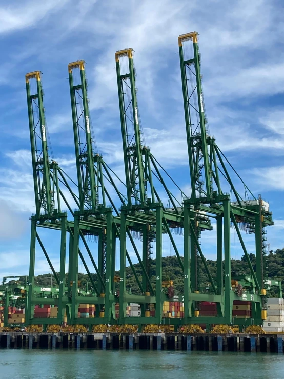 many cranes are attached to the side of a large boat