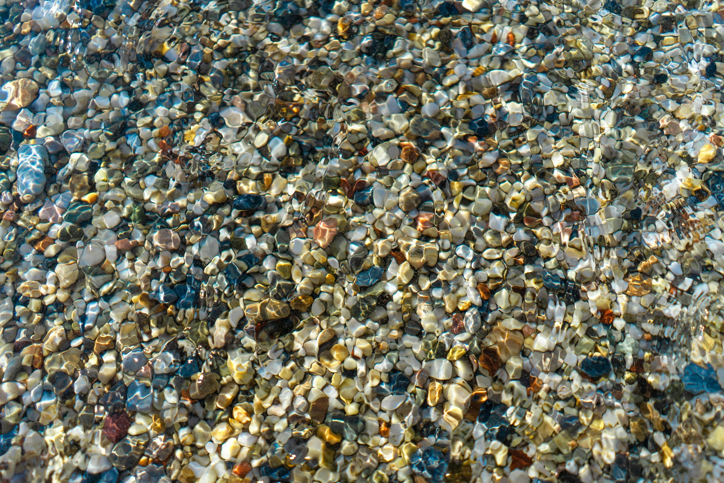 the water is reflecting a very clear stone