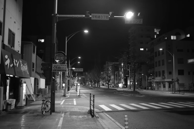 a very big pretty street at night with some lights