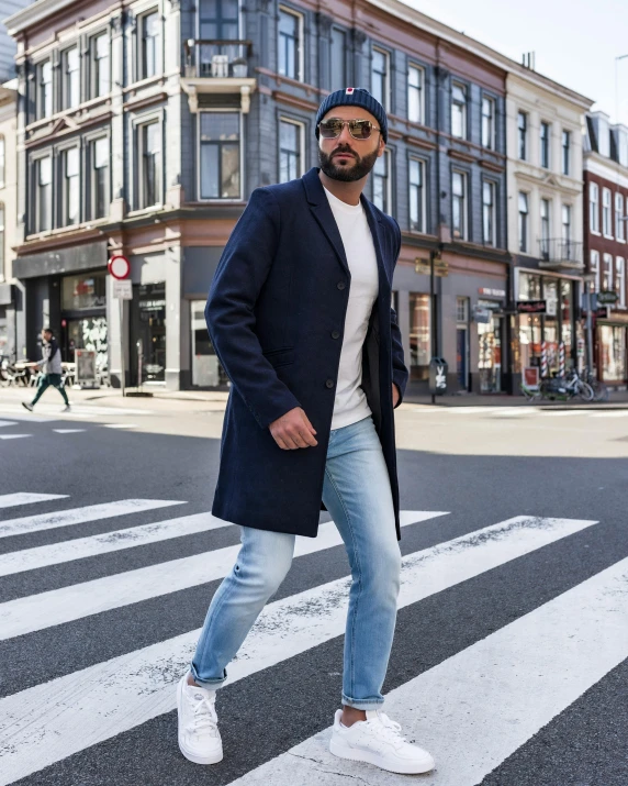 a man wearing a hat standing on a cross walk