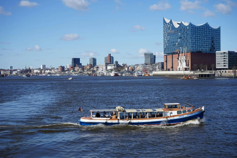 a boat with two people on it out in the water