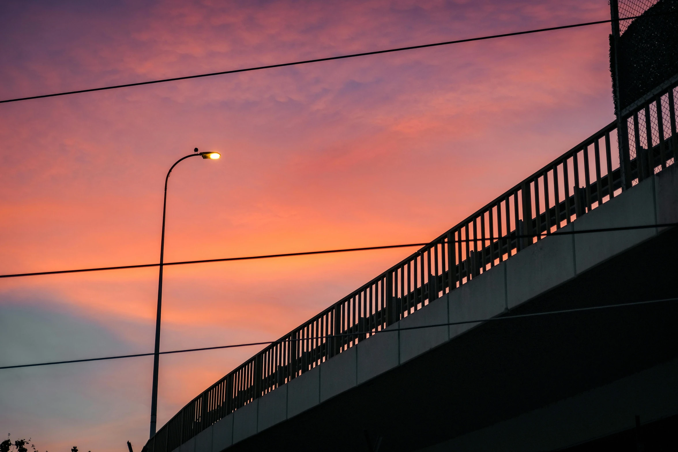 a close up of a light pole on a bridge