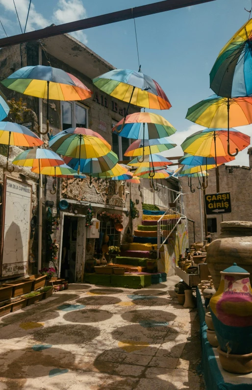 colorful umbrellas outside a cafe near the street