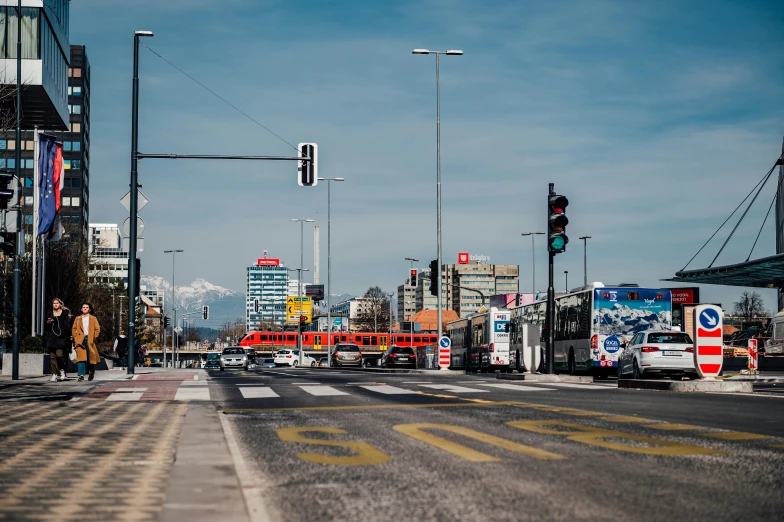 a city street with some traffic lights and vehicles