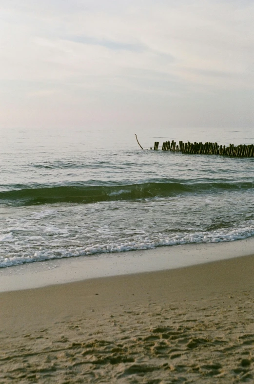 the waves are coming in onto the beach