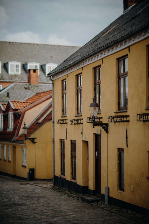 two old buildings are shown with yellow paint