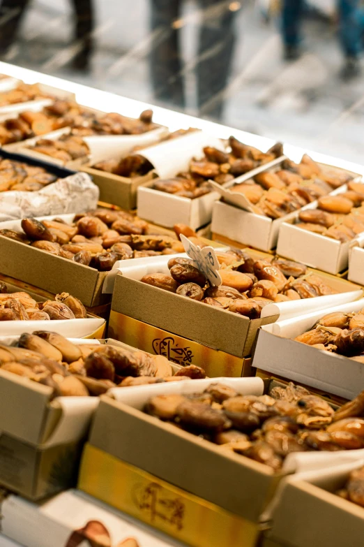 two trays are filled with sweet food