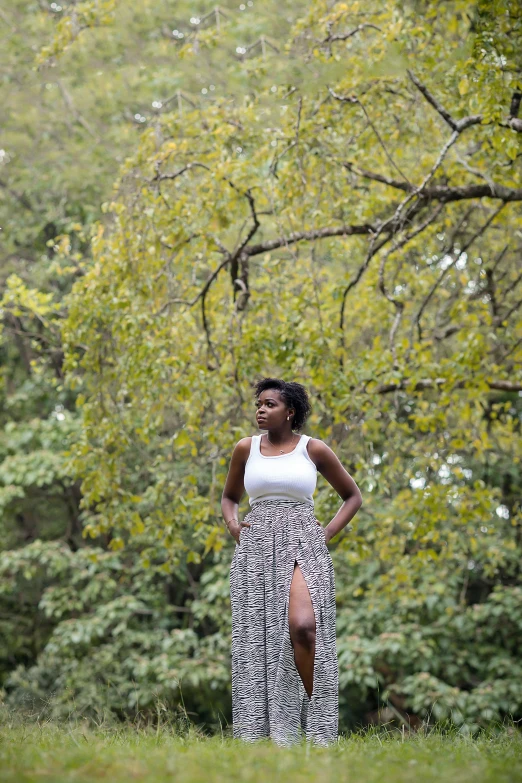 an african american woman standing in the grass