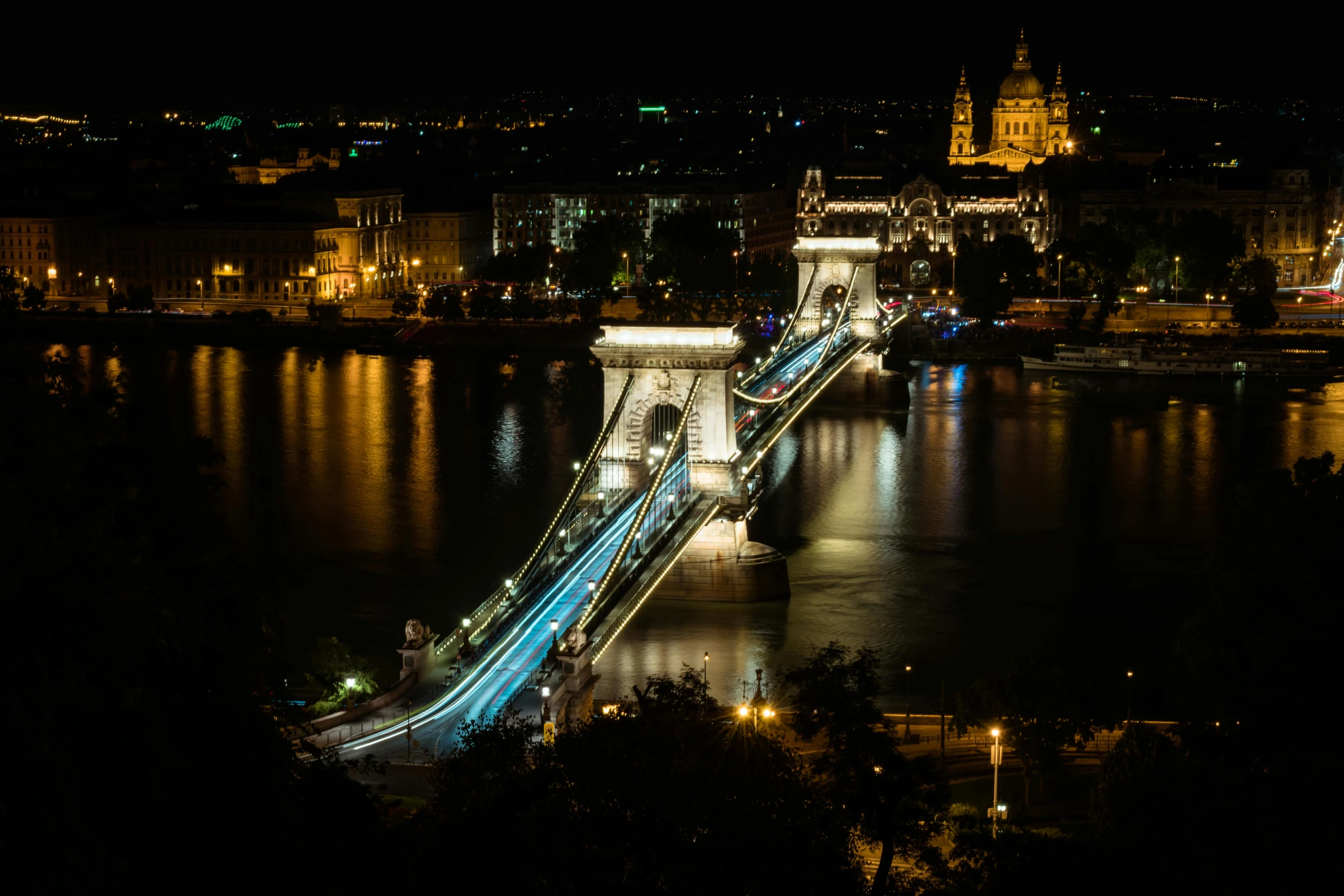 the bridge lights on and it is bright at night