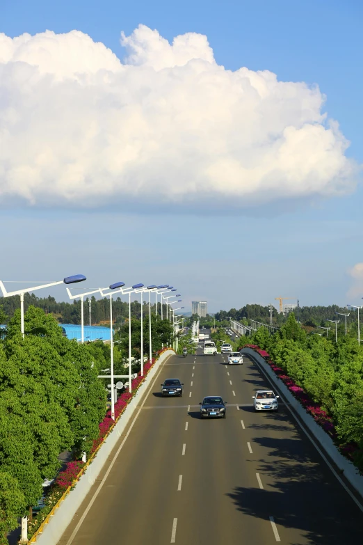 a highway under a sky with some clouds