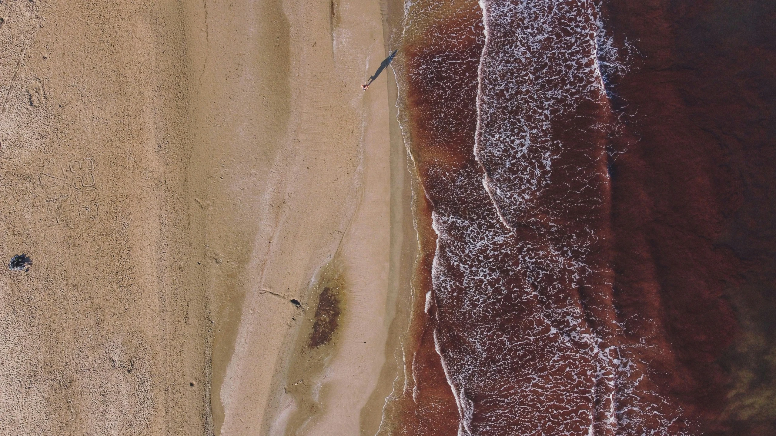 the ocean and sand are close together as if from space