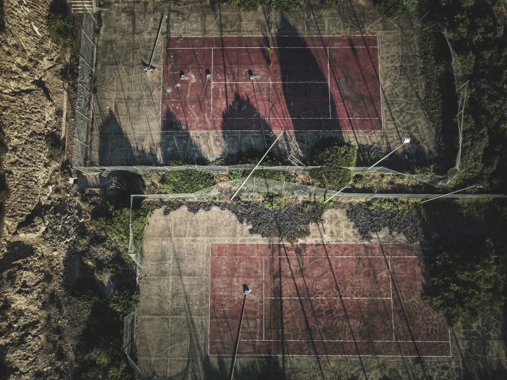 aerial pograph of a tennis court in an area