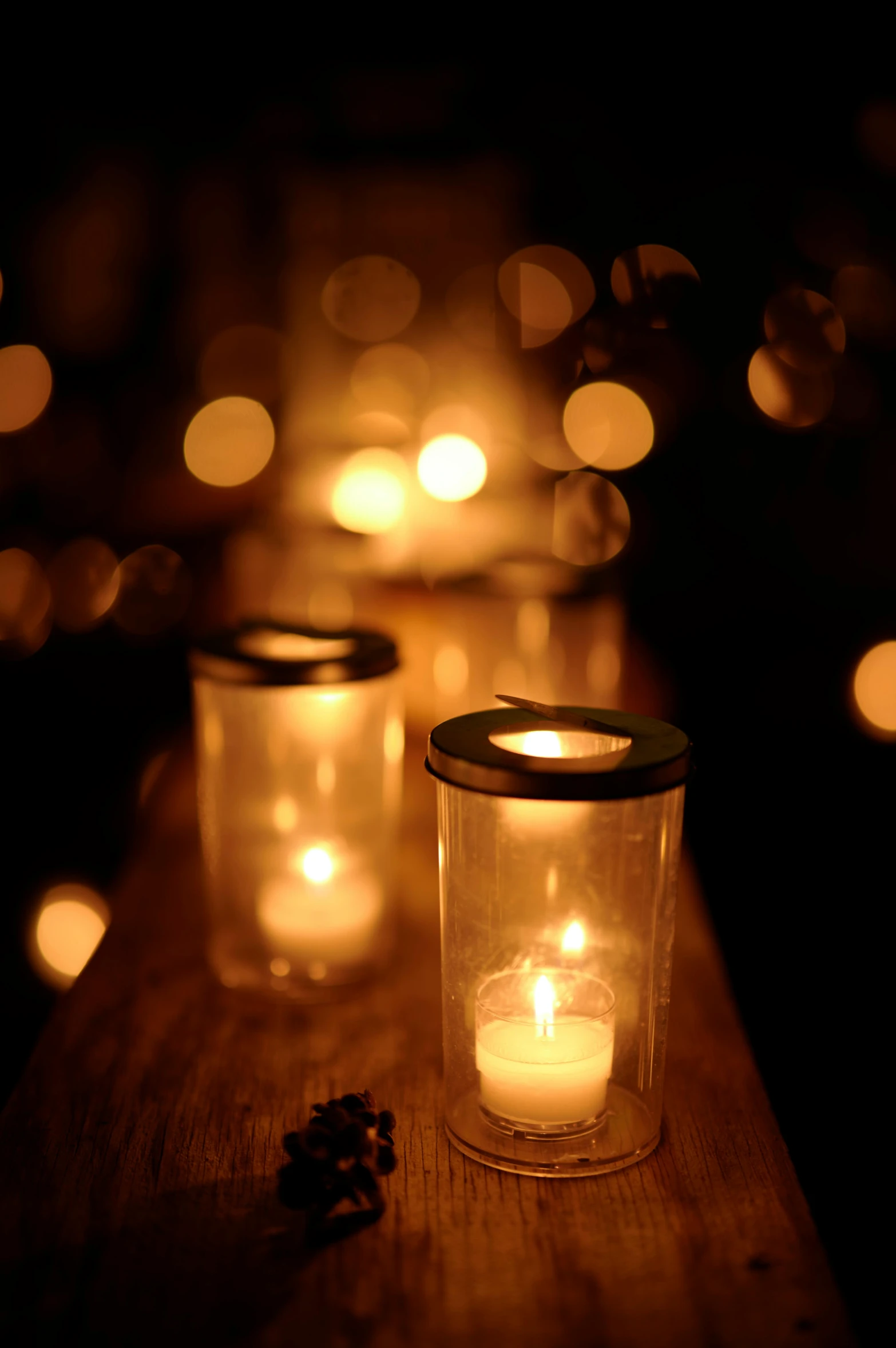 a table with some glass candles on it