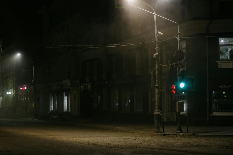 street light near a building in the dark