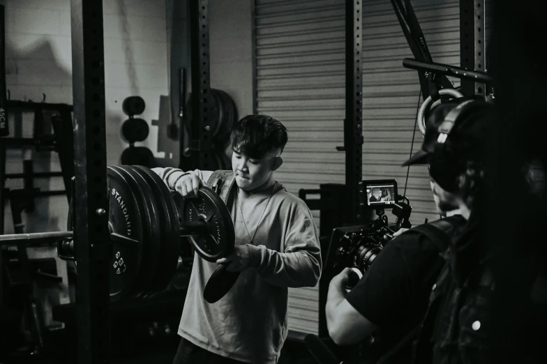 two men in the garage talking to one another