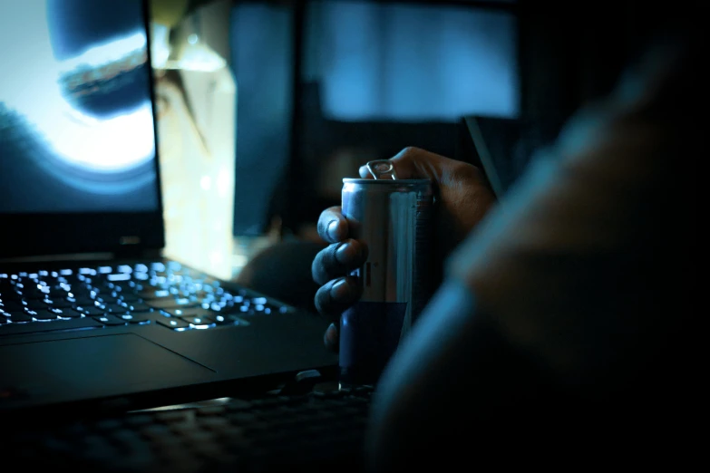 a person's hand holding up an electronic device