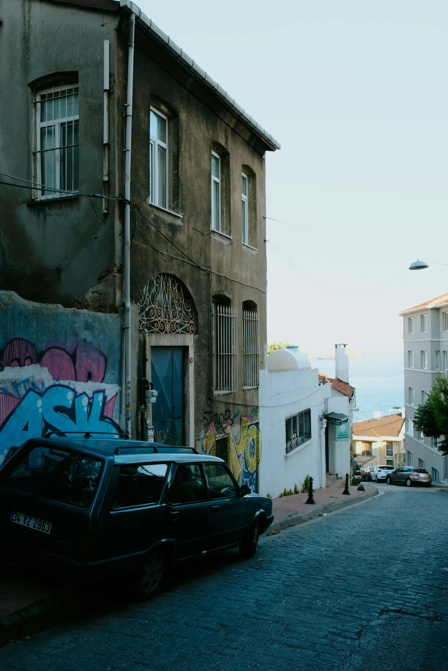 a car parked on the side of a city street