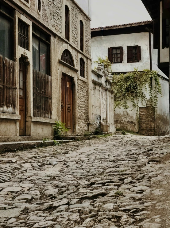 a cobblestone street with stone streets and buildings