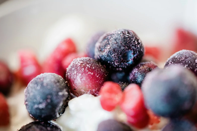 berries with yogurt and blueberries mixed in it