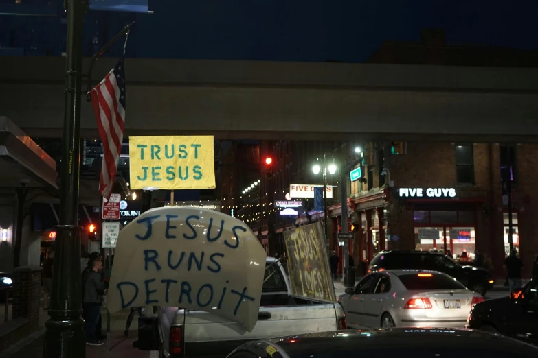 a group of people on the street in the night