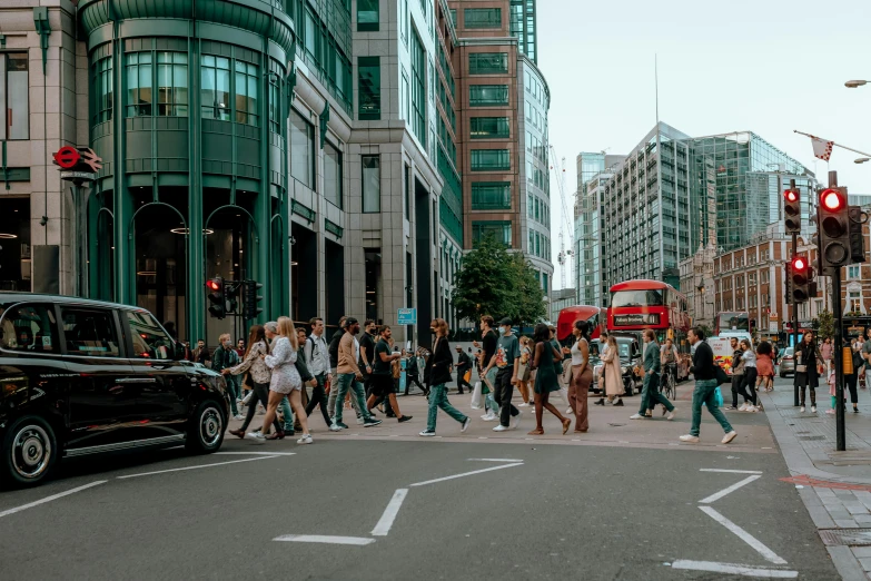 people are walking around in the city on a busy day