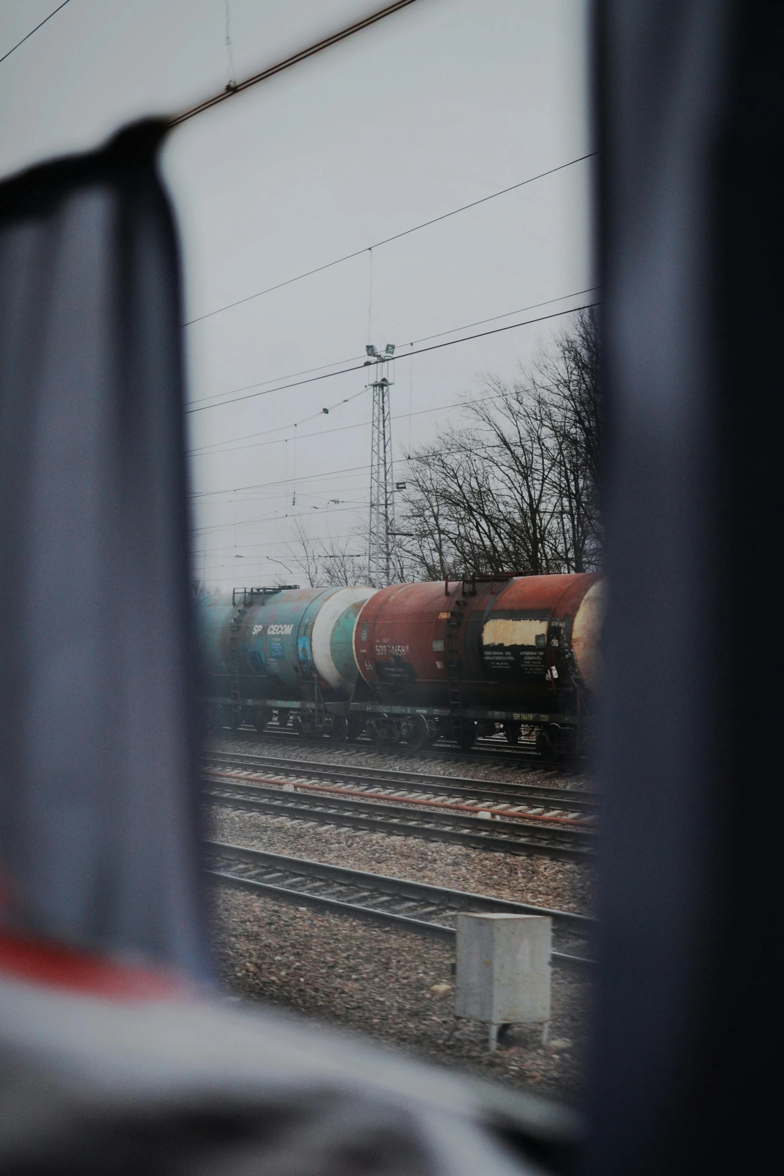 the train is traveling on tracks through the countryside