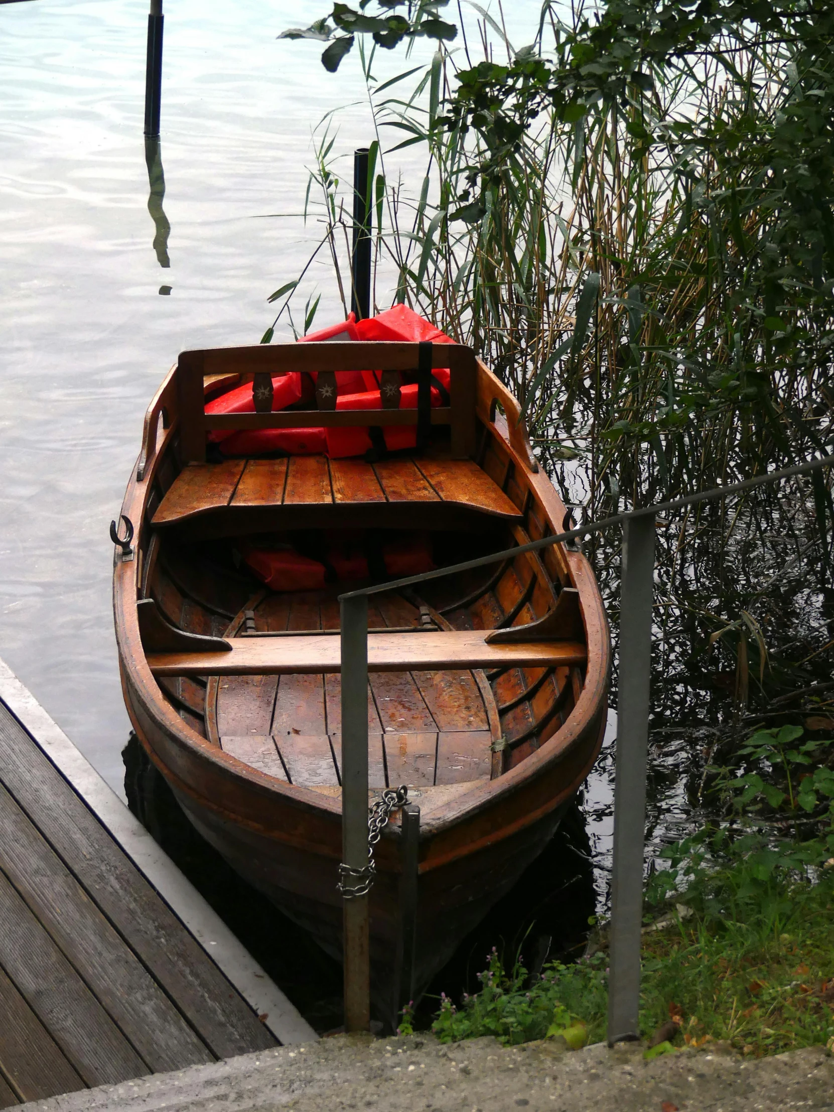 an old fashioned boat docked at a dock