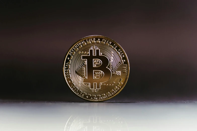 bitcoin symbol on a gray surface