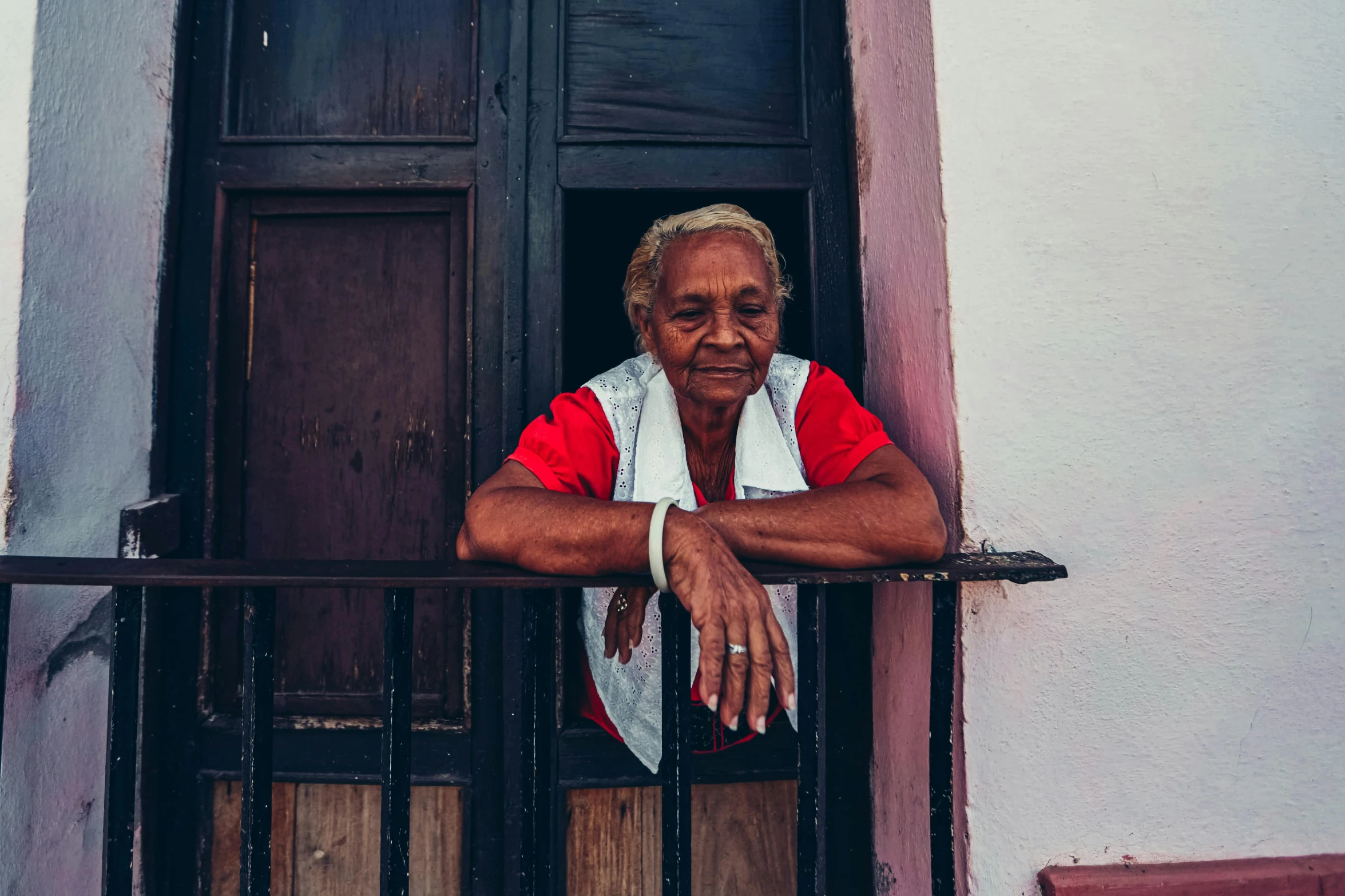 a person that is looking out of a window