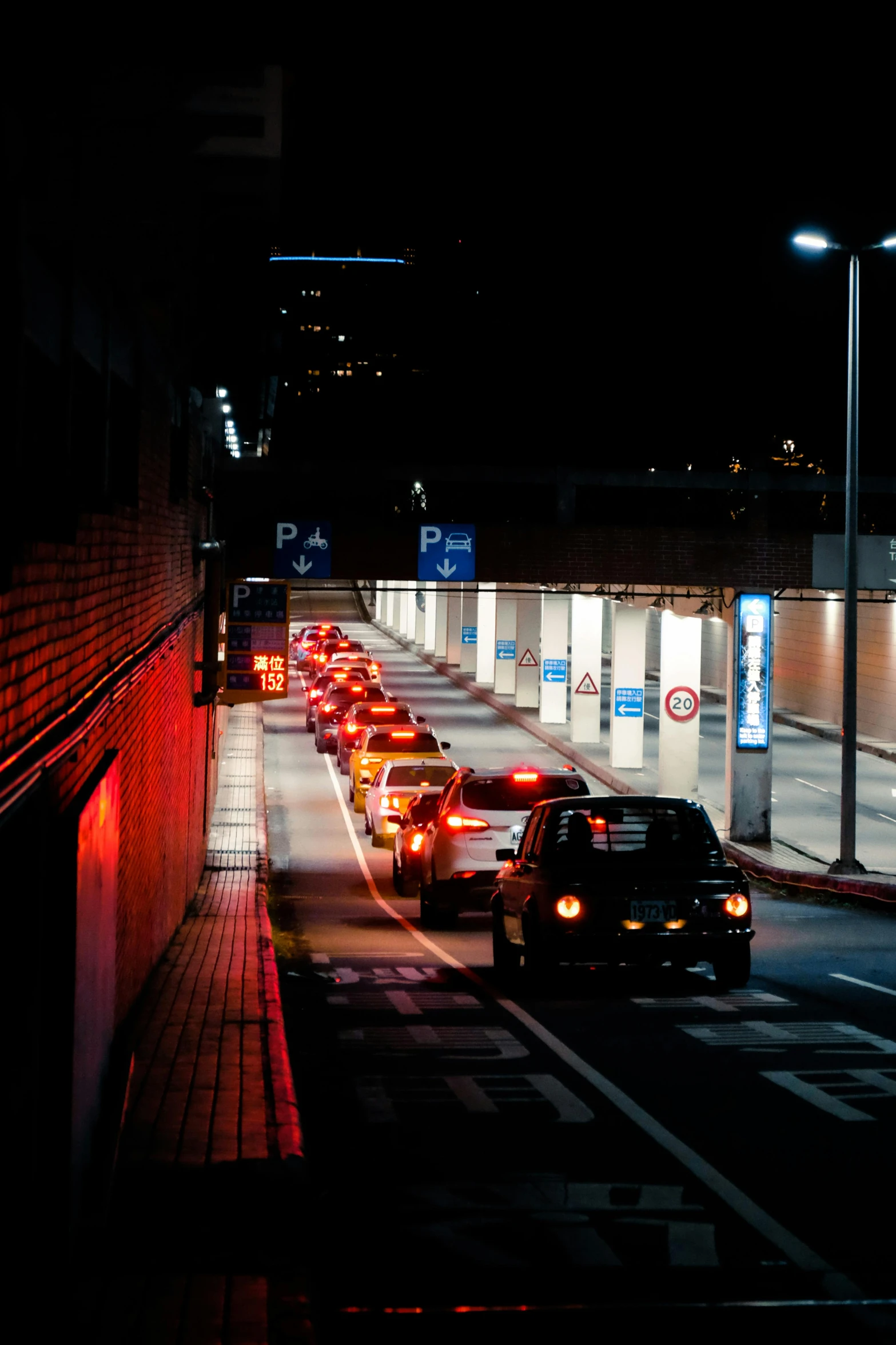 vehicles stopped at a traffic light on a highway