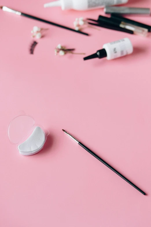 a close up of makeup brushes and eye shadow powder