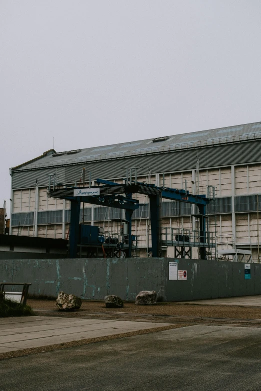 a very large building sitting on top of a cement field