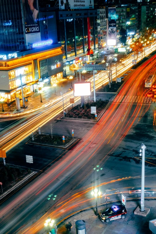 an intersection with cars and trucks at night