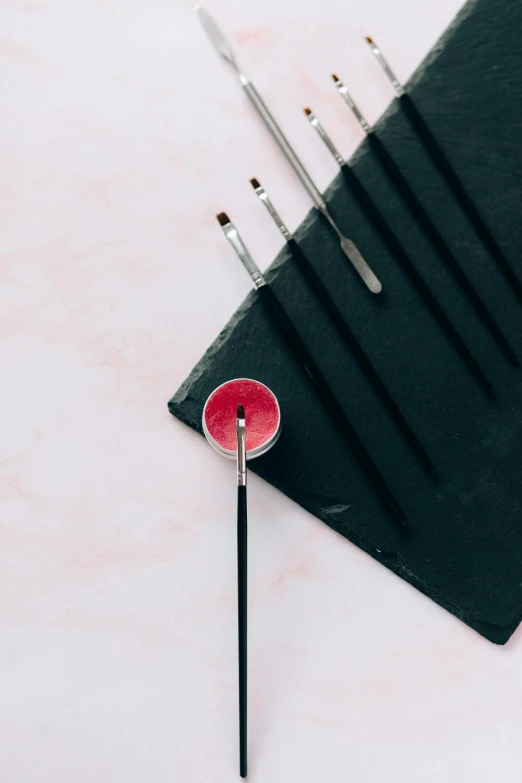 a close up of a pencil and some sort of item