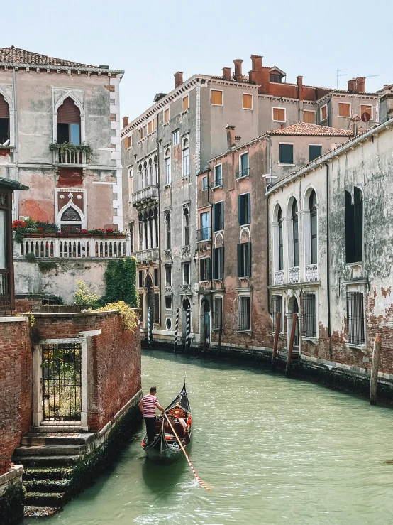 the boat is going down a narrow canal