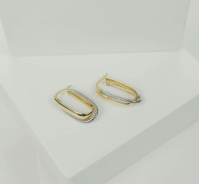 an image of two different earrings on a table