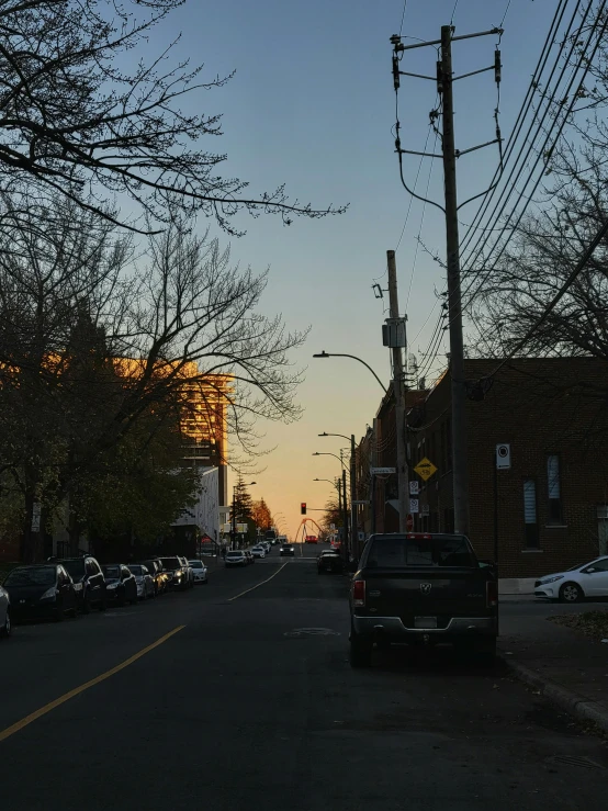 a car is parked on the side of a city street