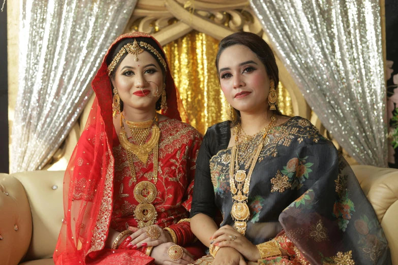 two beautiful young women in traditional indian wear