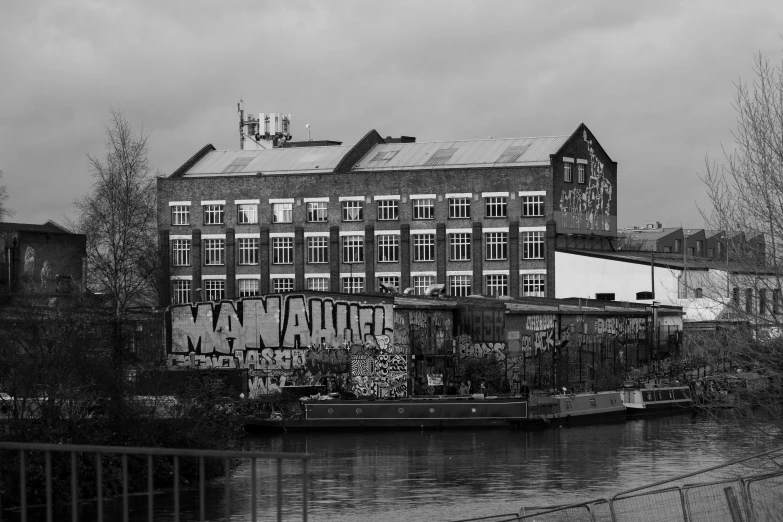 the old building is next to some very large water