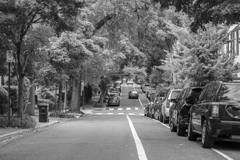 a couple of cars parked on the side of a road