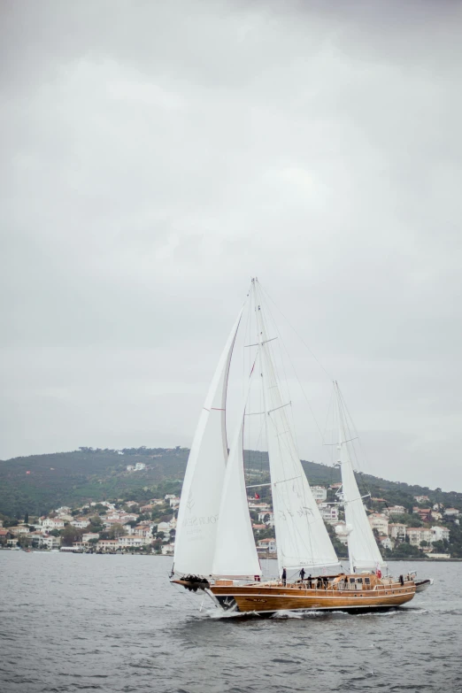 a large sailboat on the water with lots of sails