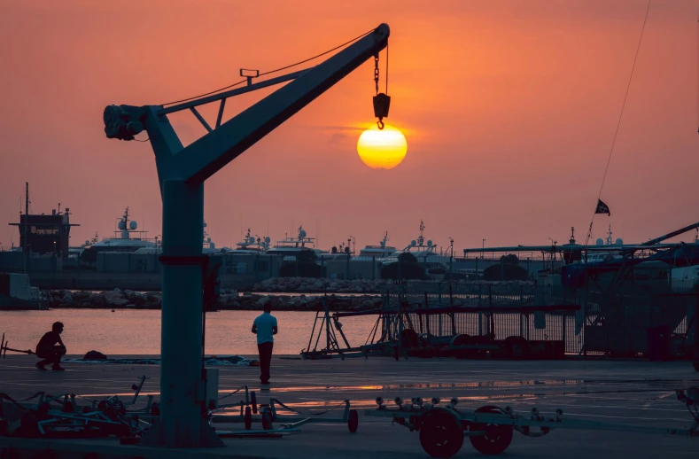 a person is standing outside watching the sun set